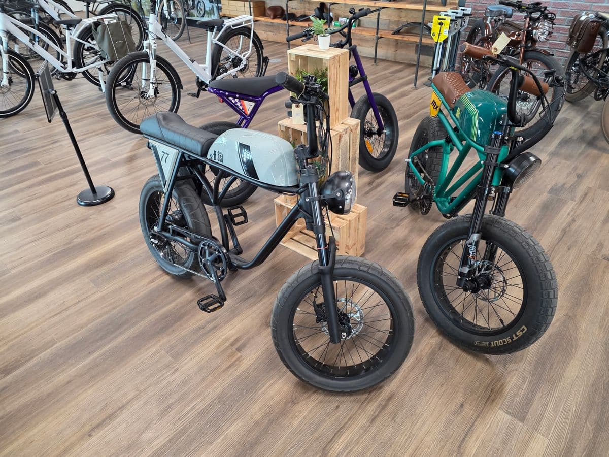 Showroom floor featuring Greaser and Outsider models in multiple colours