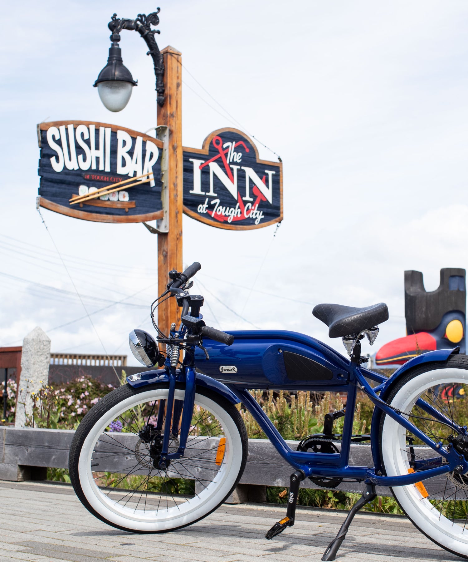 michael blast greaser ebike close up in front of restaurant sign